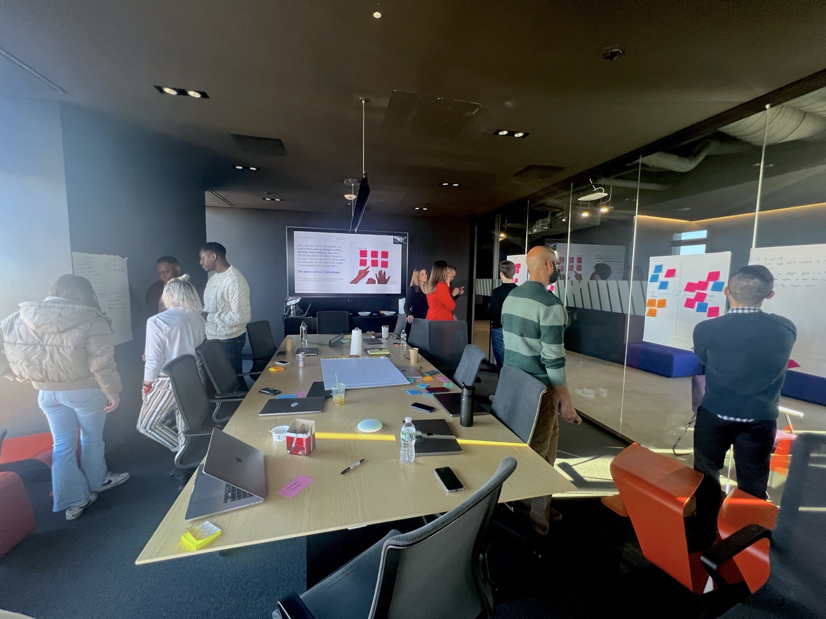 A full room of WHOOP teammates working in small groups during a quarterly onsite workshop