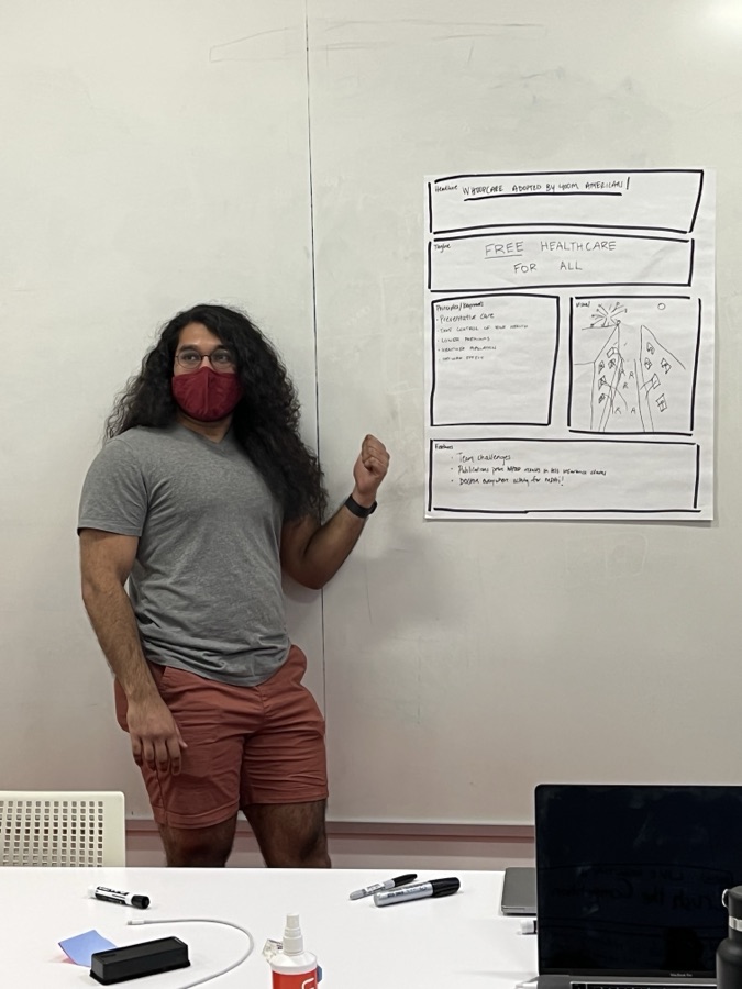 A teammate presenting at a whiteboard